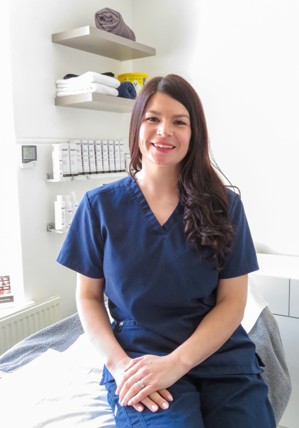 Natasha Turner, founder of Lumeé Skin Clinic, in clinical scrubs in the treatment room